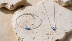 Silver evil eye bracelet and necklace with blue glass eye bead